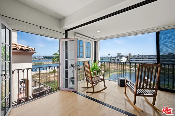 a view of balcony with furniture