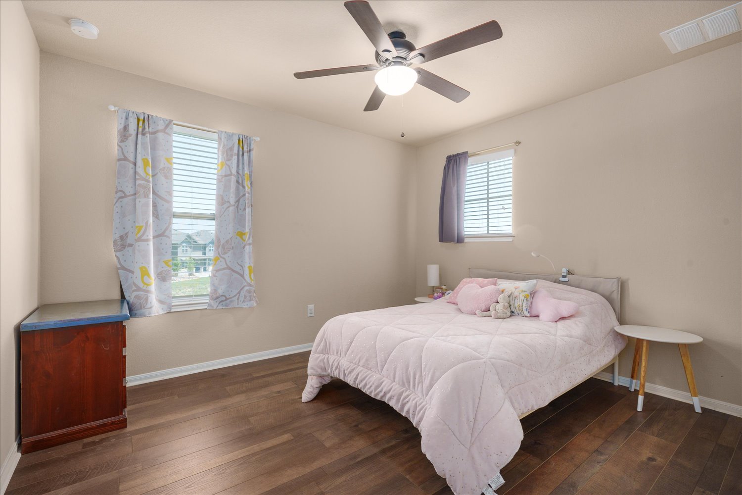 717 Kaluga Trail Leander, TX 78641 - Photo 20 of 40 a bedroom with a bed and wooden floor