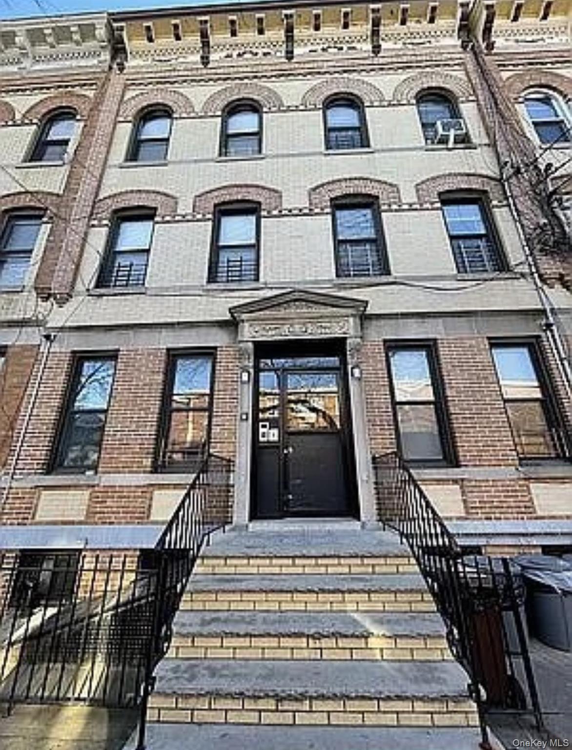 Undisclosed Address Queens, NY 11385 - Photo 1 of 6 a view of a building with a clock