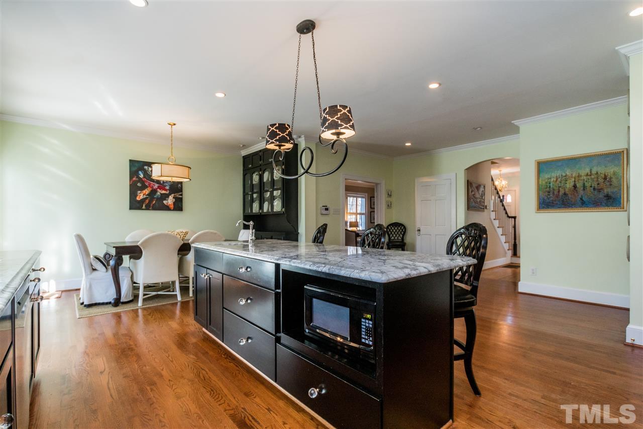 3205 Merriman Avenue Raleigh, NC 27607 - Photo 11 of 30 a dining room with furniture and wooden floor