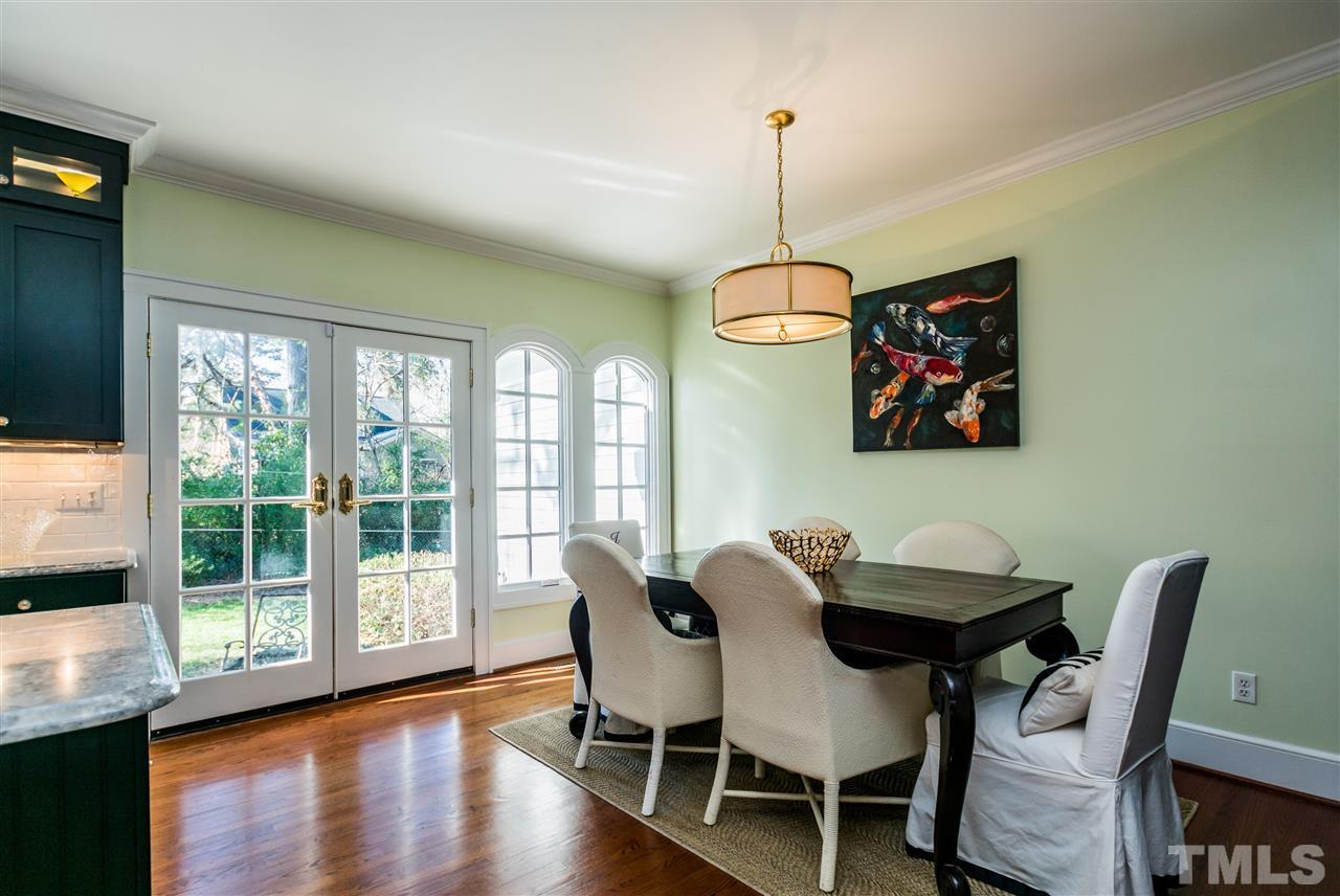 3205 Merriman Avenue Raleigh, NC 27607 - Photo 12 of 30 a view of a dining room with furniture window and wooden floor