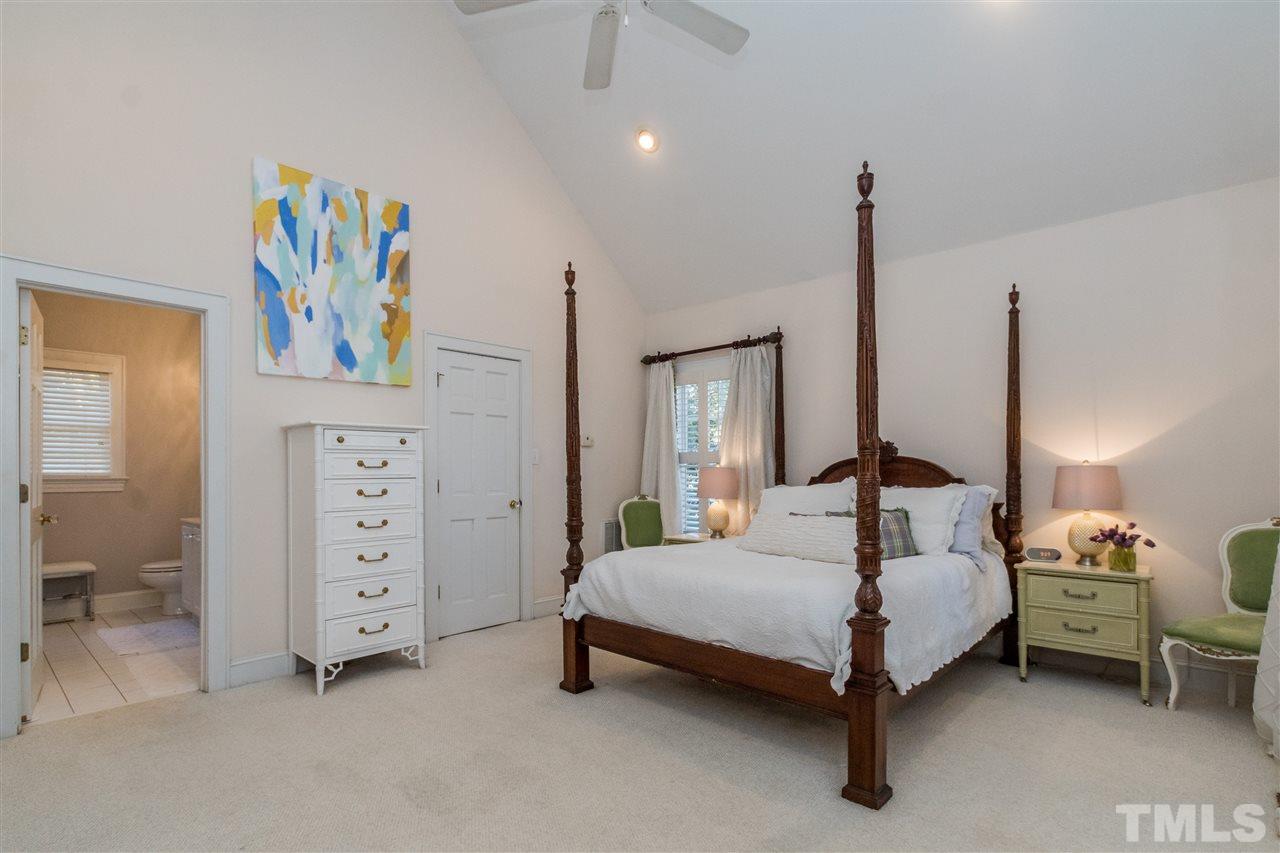 3205 Merriman Avenue Raleigh, NC 27607 - Photo 13 of 30 a bedroom with a bed chandelier and a window