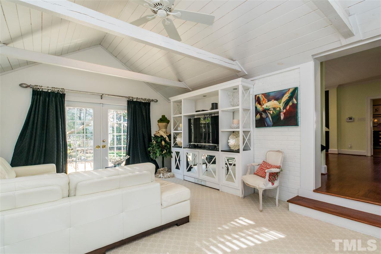 3205 Merriman Avenue Raleigh, NC 27607 - Photo 17 of 30 a living room with furniture and a flat screen tv