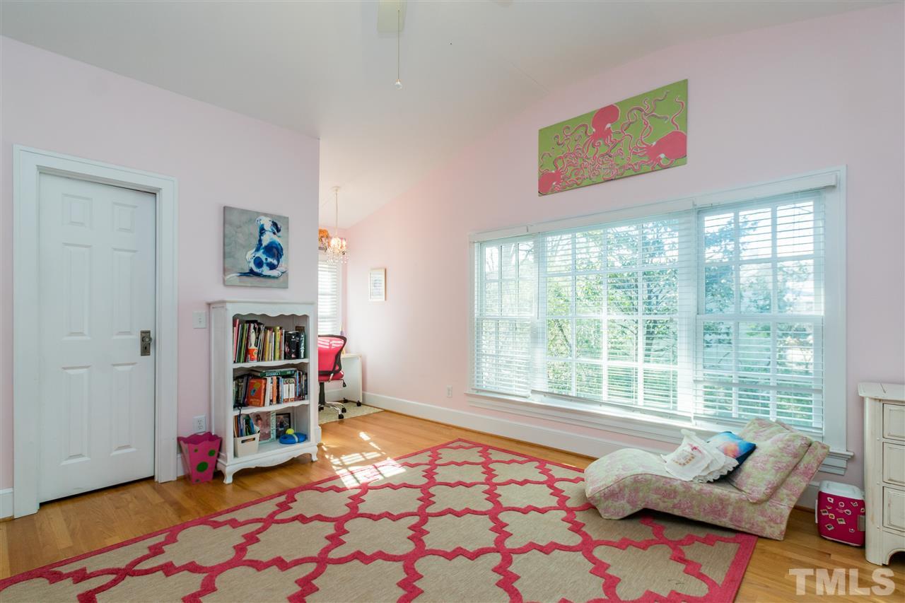 3205 Merriman Avenue Raleigh, NC 27607 - Photo 20 of 30 a living room with furniture and a book shelf