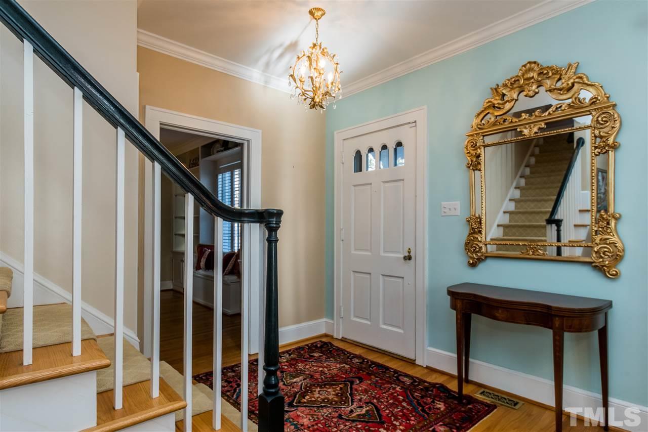 3205 Merriman Avenue Raleigh, NC 27607 - Photo 4 of 30 a view of a hallway with wooden floor and staircase