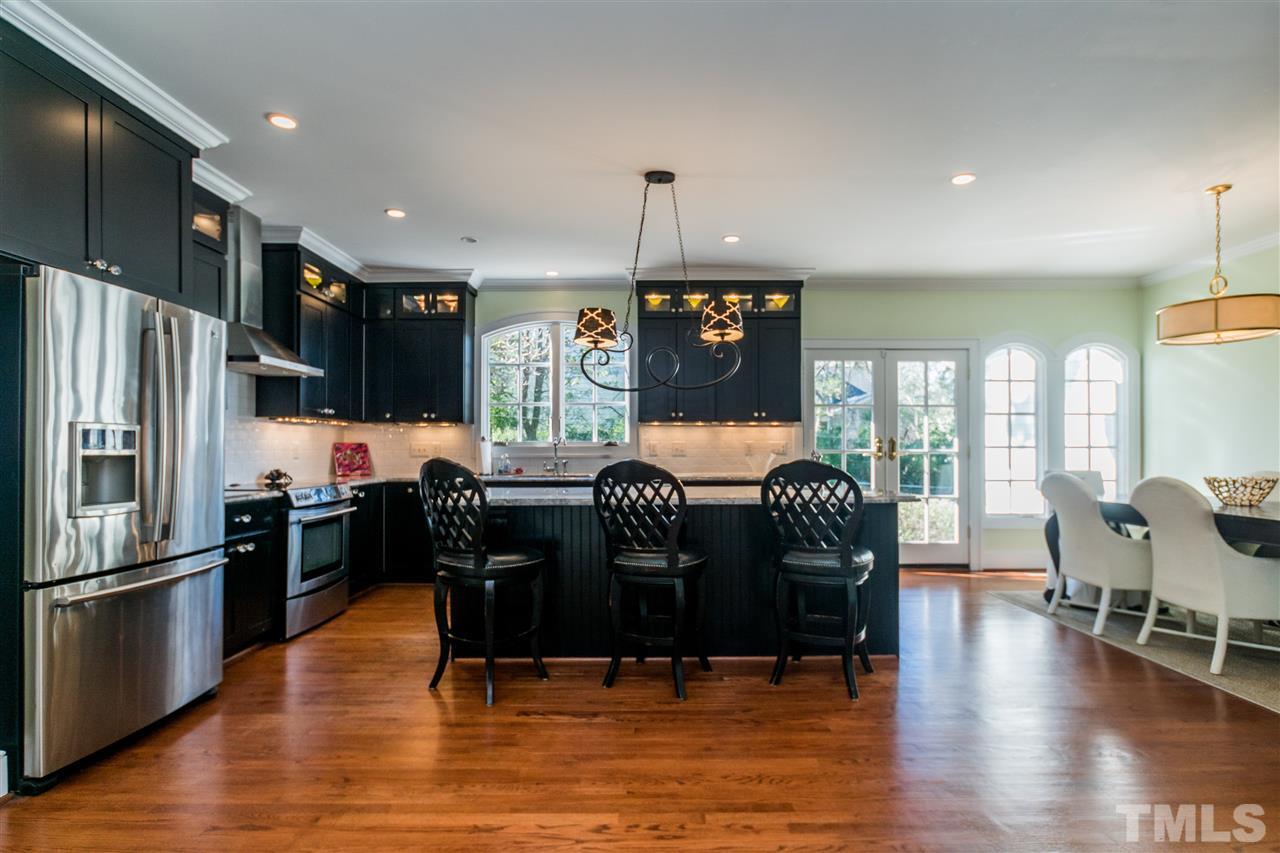 3205 Merriman Avenue Raleigh, NC 27607 - Photo 8 of 30 a view of a dining room with furniture window and wooden floor