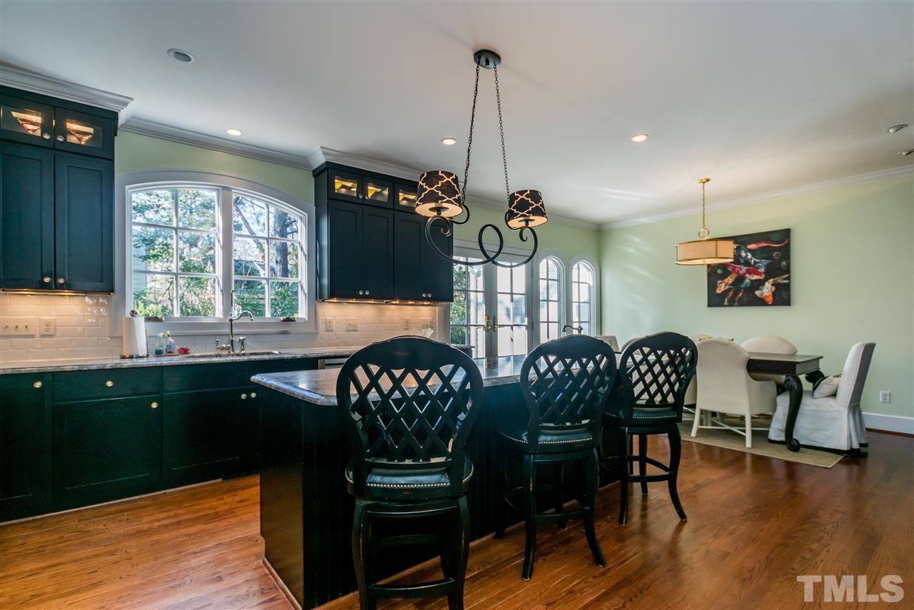 3205 Merriman Avenue Raleigh, NC 27607 - Photo 10 of 30 a view of a dining room with furniture window and wooden floor