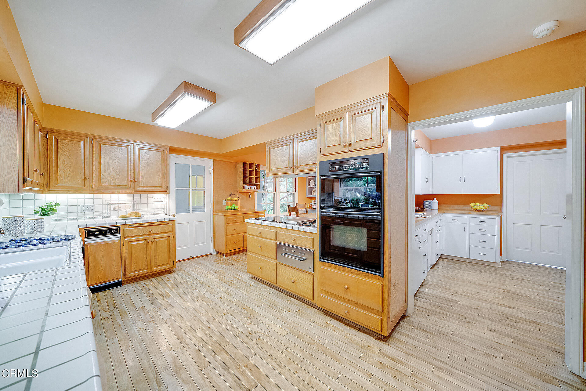 2035 South Oak Knoll Avenue San Marino, CA 91108 - Photo 15 of 29 a large kitchen with stainless steel appliances granite countertop a stove and a refrigerator