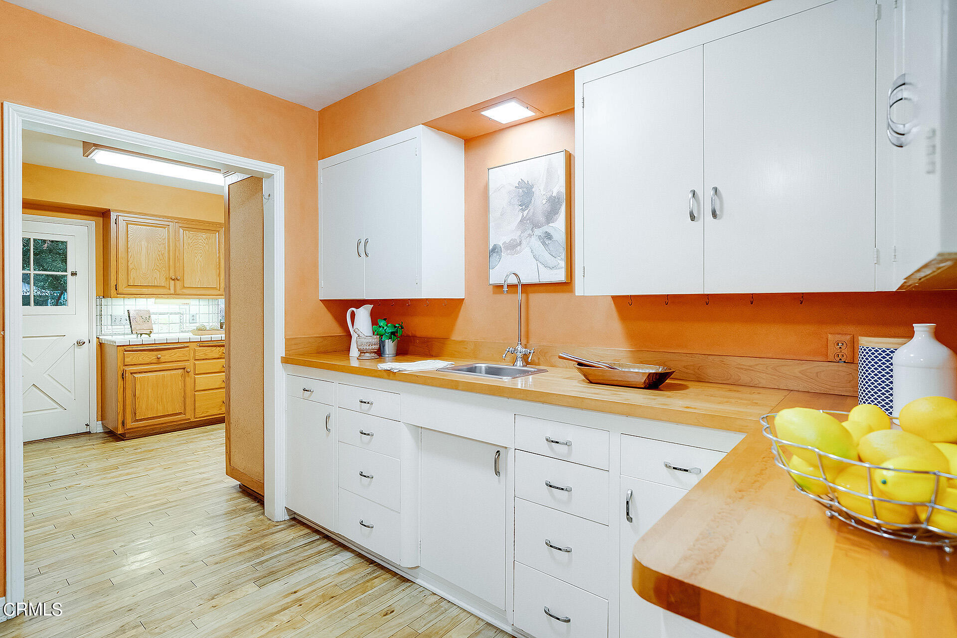 2035 South Oak Knoll Avenue San Marino, CA 91108 - Photo 17 of 29 a kitchen with a sink and cabinets