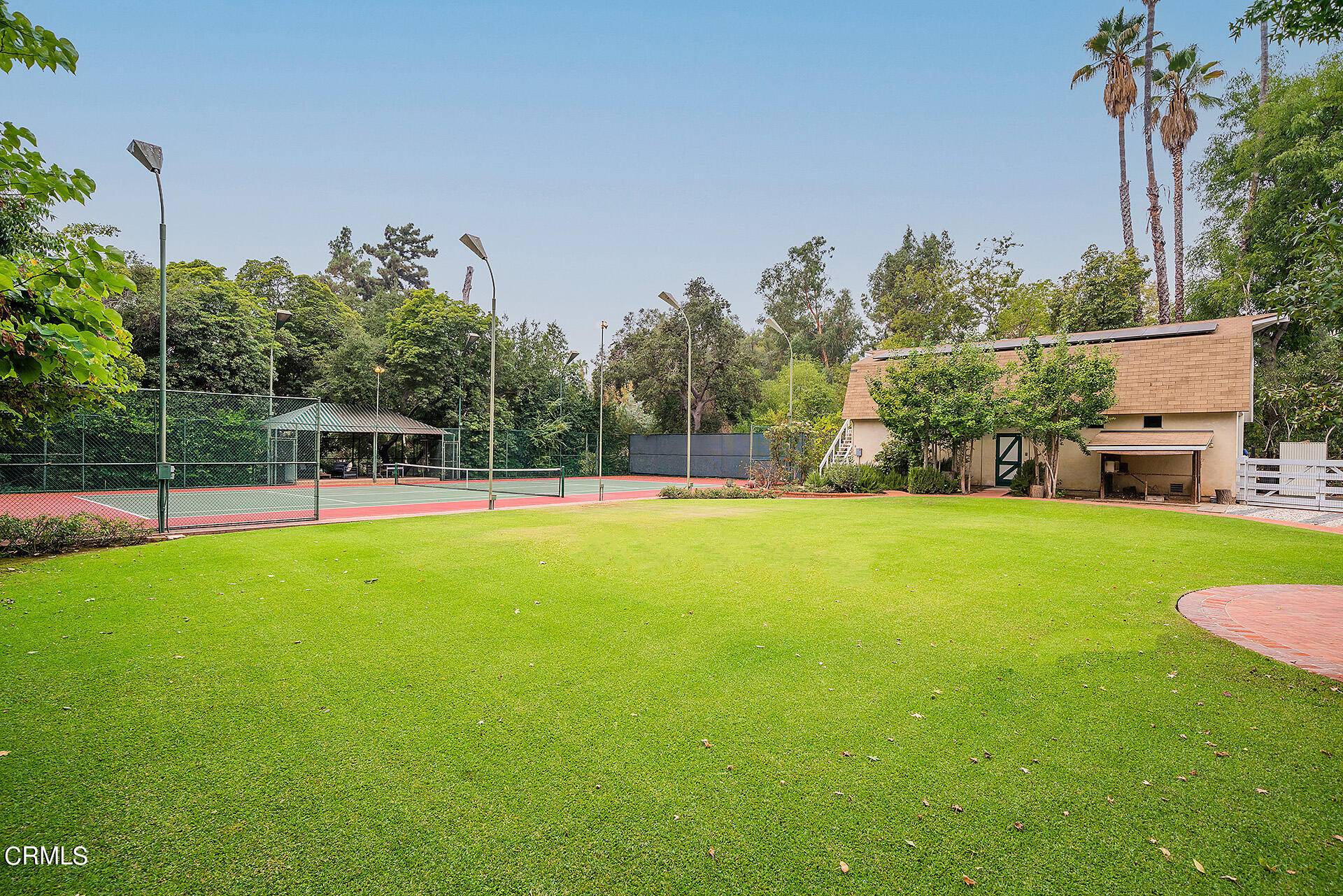 2035 South Oak Knoll Avenue San Marino, CA 91108 - Photo 25 of 29 a view of yard with swimming pool and green space