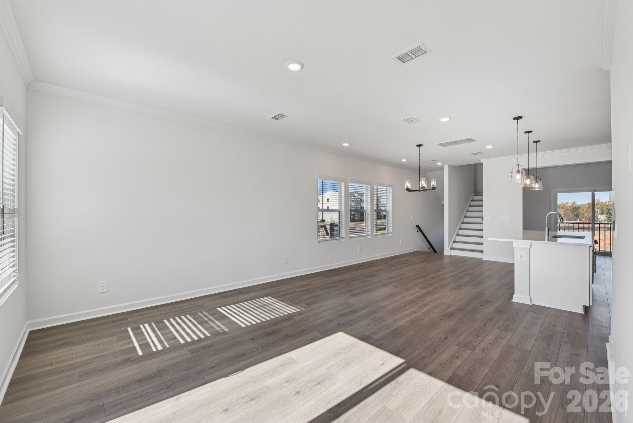 343 Golden Maple Court Fort Mill, SC 29708 - Photo 8 of 19 a view of kitchen and hall with wooden floor