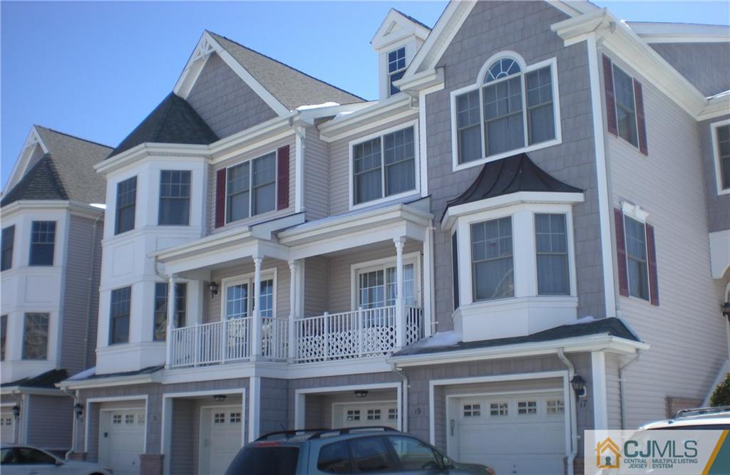 19 Raritan Reach Road South Amboy, NJ 08879 - Photo 1 of 6 a front view of a building with a lot of windows