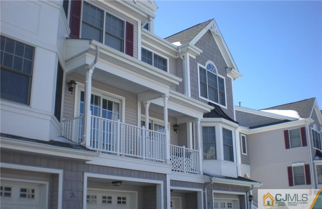 19 Raritan Reach Road South Amboy, NJ 08879 - Photo 2 of 6 a front view of a building with a lot of windows