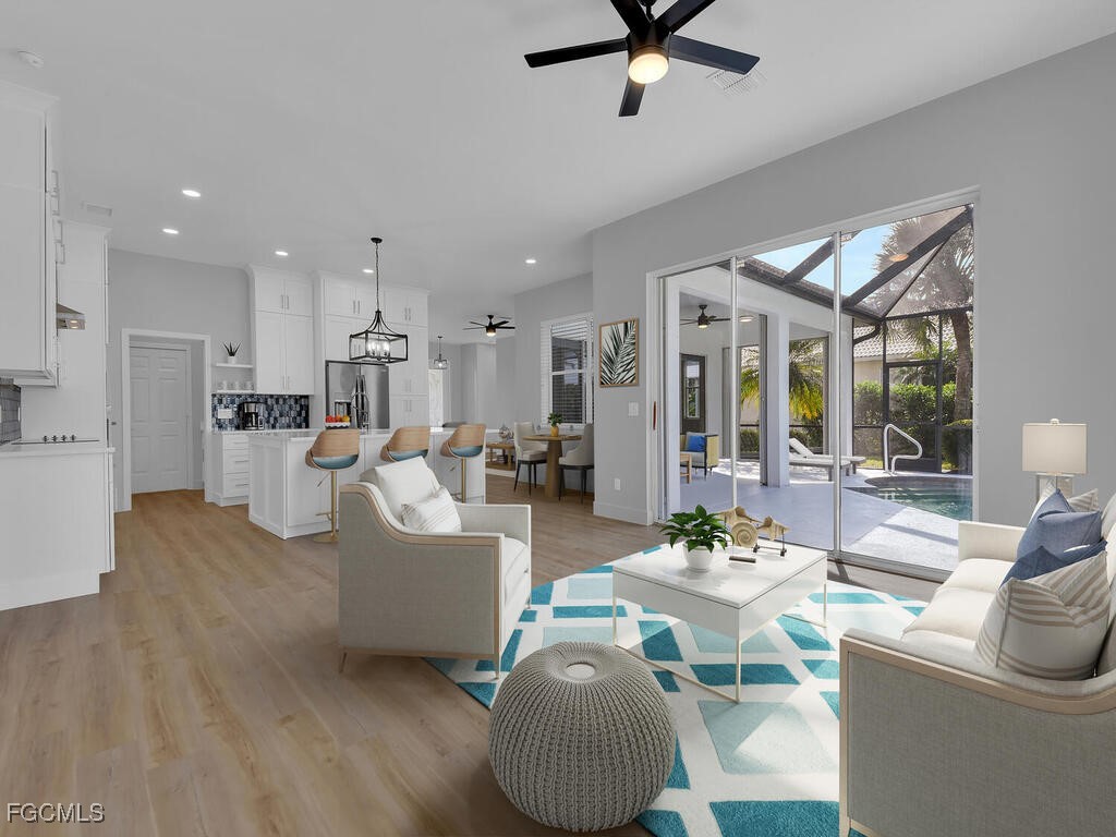 11081 Mahogany Run Fort Myers, FL 33913 - Photo 3 of 50 a living room with furniture and a view of kitchen