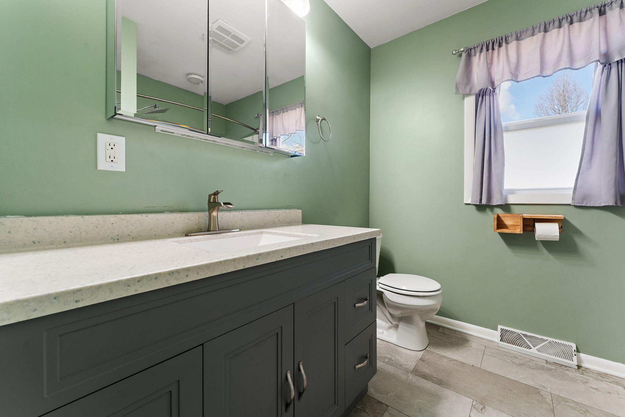 947 North Wood Street Griffith, IN 46319 - Photo 13 of 25 a bathroom with a sink and a toilet