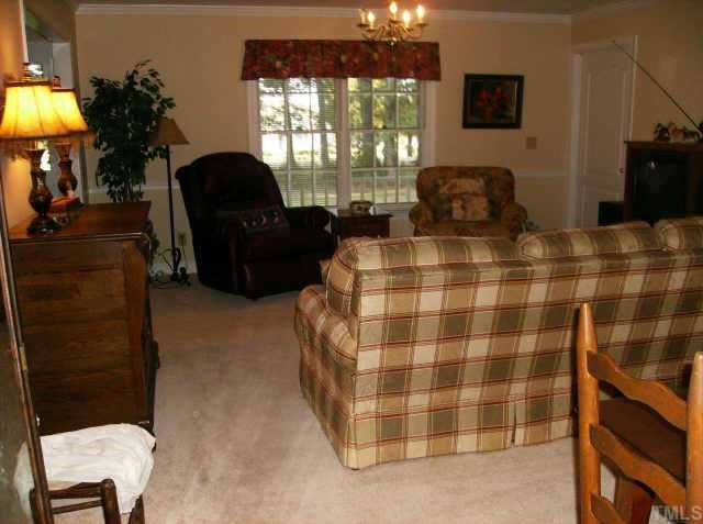301 Hesters Store Road Roxboro, NC 27574 - Photo 3 of 6 a bedroom with a bed and lamp