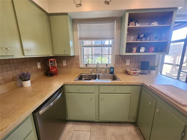 a kitchen with a sink and cabinets
