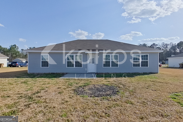 228 Western Red Cedar Drive Springfield, GA 31329 - Photo 25 of 27 a front view of a house with garden