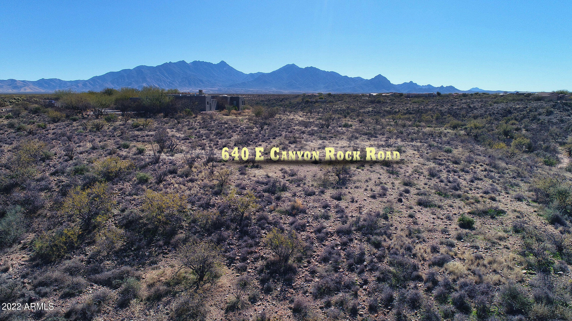 640 East Canyon Rock Road, Unit 49 Green Valley, AZ 85614 - Photo 1 of 34 a view of a lake with mountain in the background