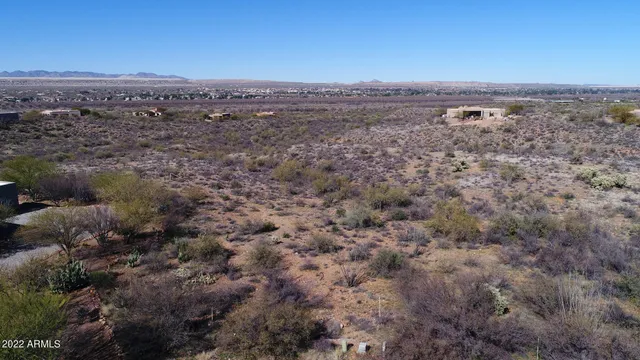 a view of a town with mountains in the background