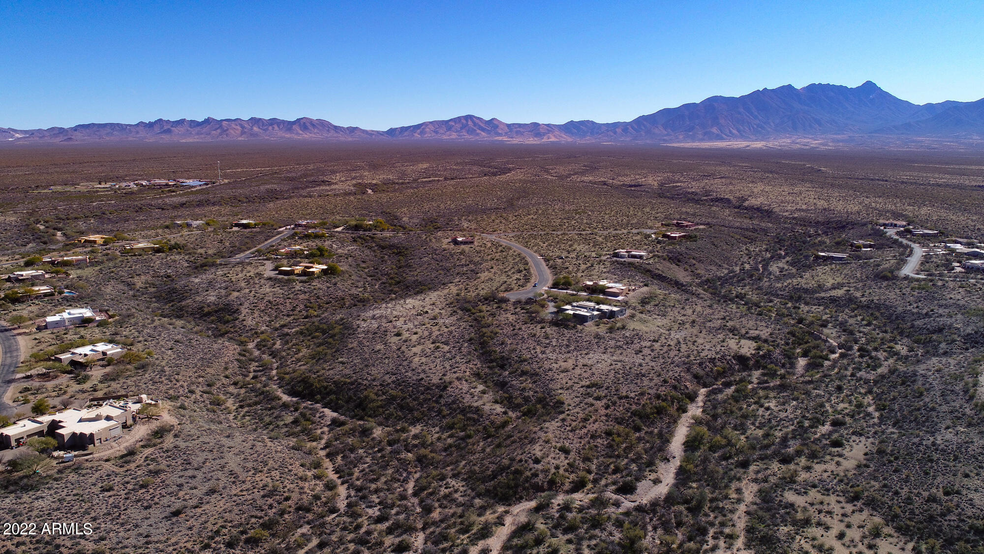 640 East Canyon Rock Road, Unit 49 Green Valley, AZ 85614 - Photo 16 of 34 a view of a town with mountains in the background