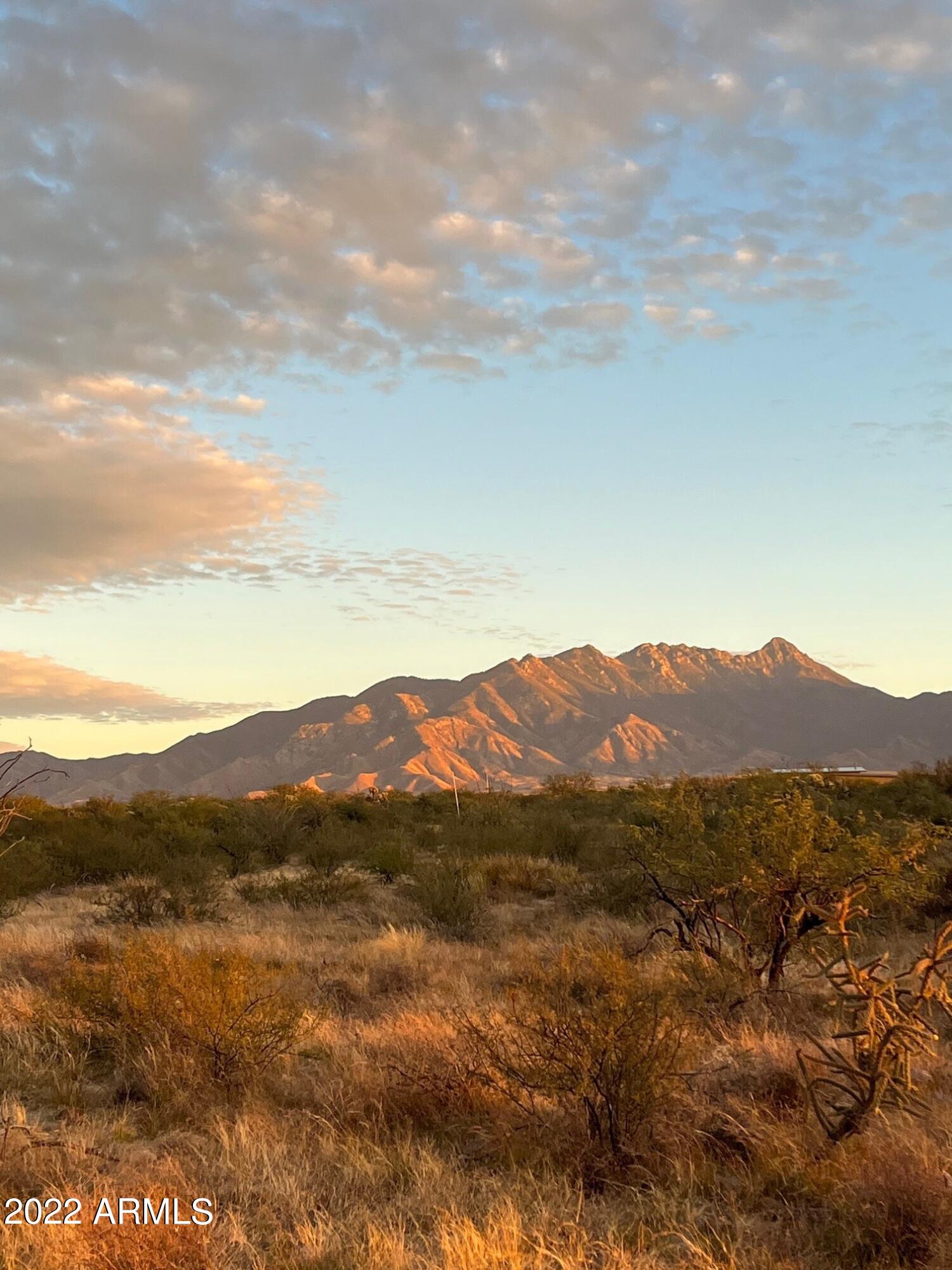 640 East Canyon Rock Road, Unit 49 Green Valley, AZ 85614 - Photo 2 of 34 a view of a mountain range with lush green forest