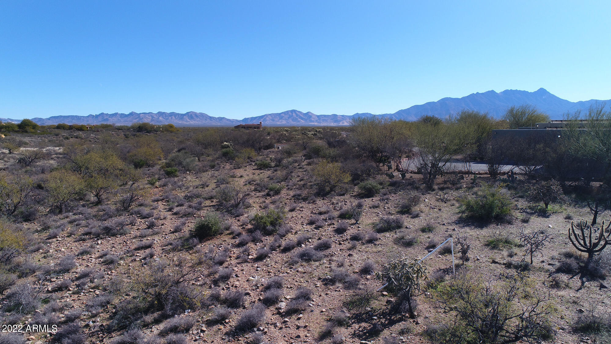 640 East Canyon Rock Road, Unit 49 Green Valley, AZ 85614 - Photo 22 of 34 a view of a forest with mountains in the background