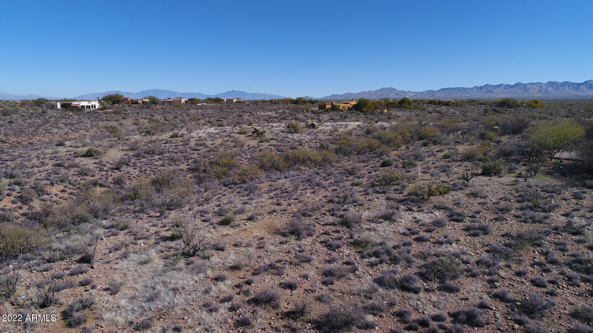 640 East Canyon Rock Road, Unit 49 Green Valley, AZ 85614 - Photo 23 of 34 a view of a dry field with trees in the background