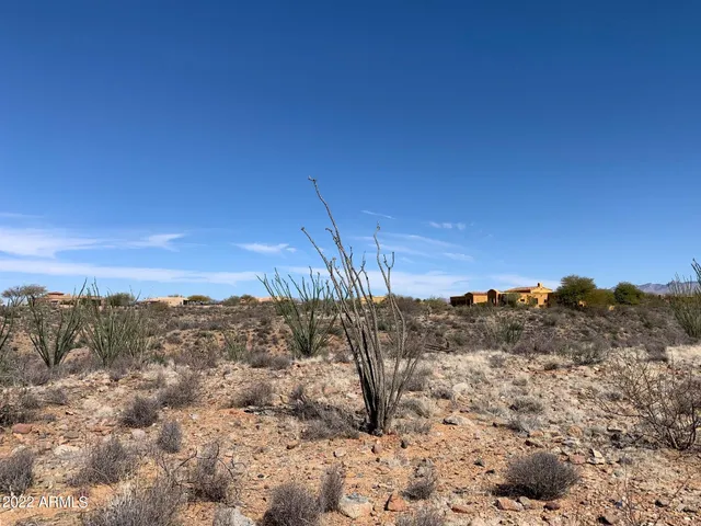 a view of a mountain range with lush green forest
