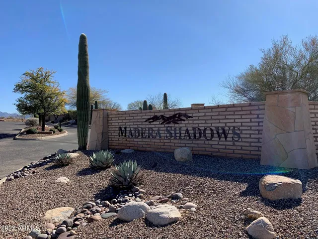 a view of a terrace with chairs and potted plants