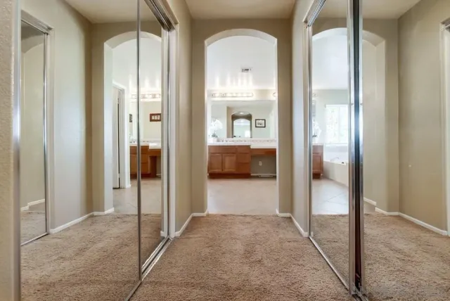 a view of a bathroom with a glass door and a glass door shower