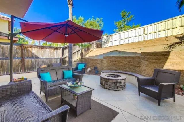 a view of a chairs and table in the patio