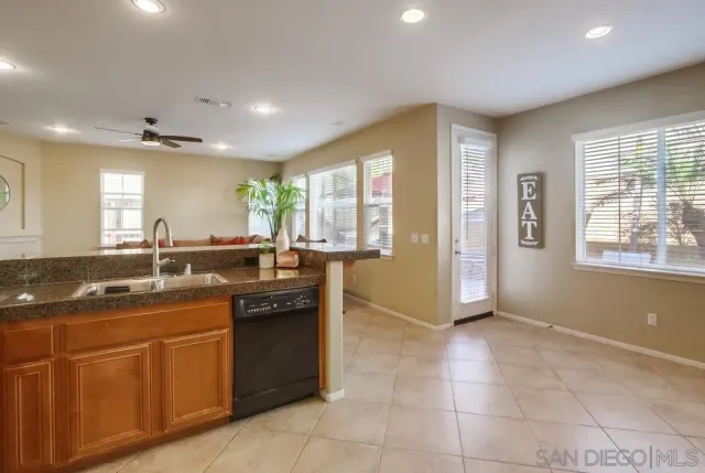 a kitchen with stainless steel appliances granite countertop a sink and cabinets