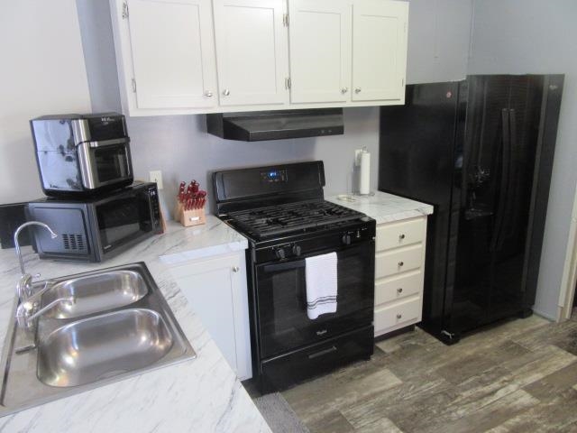 3251 E Road, Unit 99 Clifton, CO 81520 - Photo 15 of 25 a kitchen with granite countertop a stove and a sink