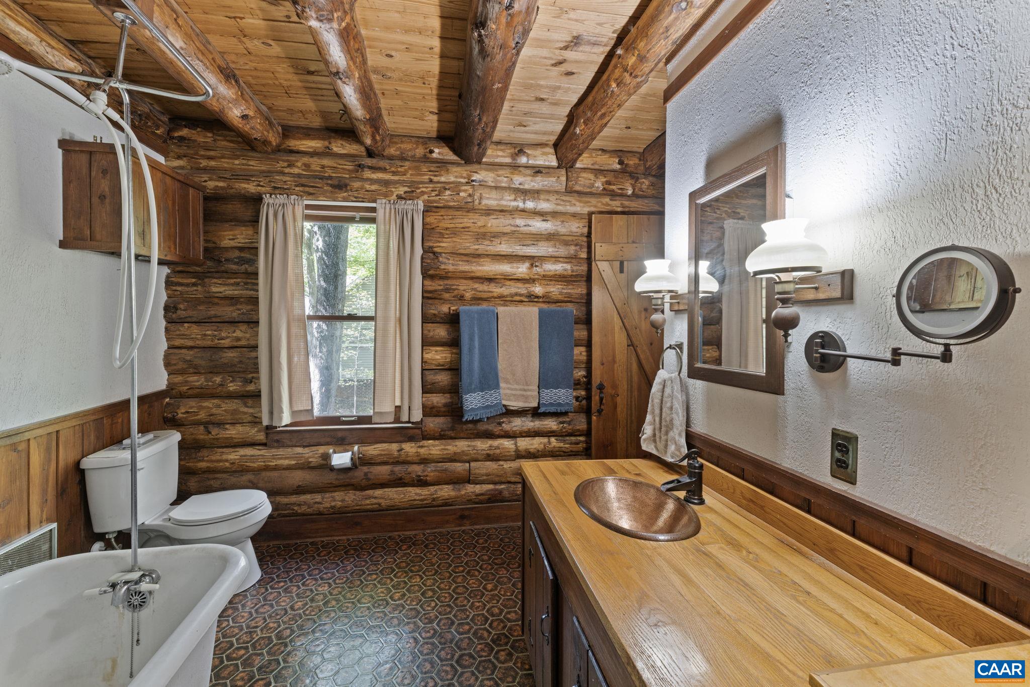 17 Dogleg Road Palmyra, VA 22963 - Photo 25 of 72 a bathroom with a granite countertop sink and a large mirror