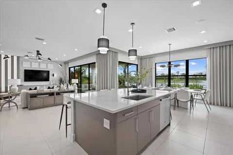 a very nice looking living room with a flat screen tv and a large window