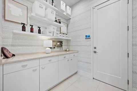 a kitchen with cabinets and window