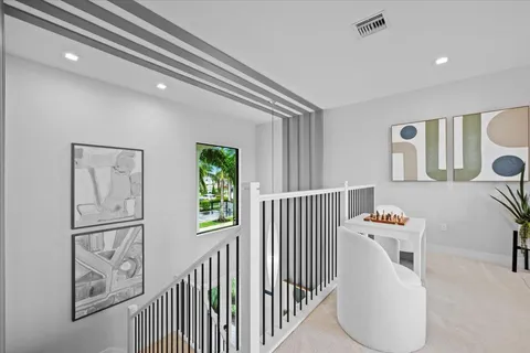 a large white kitchen with a large window