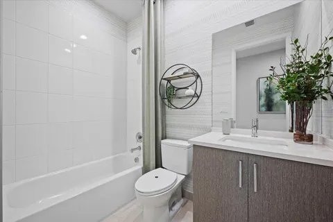 a bedroom with furniture and a large window