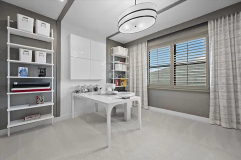 a utility room with cabinets washer and dryer