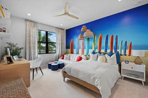 a bedroom with two beds and potted plant