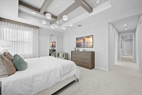 a view of a house with swimming pool and sitting area