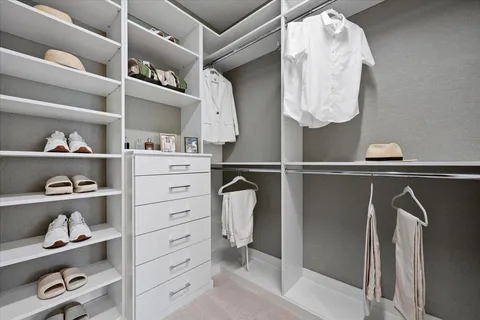 a front view of a house with a yard and outdoor seating