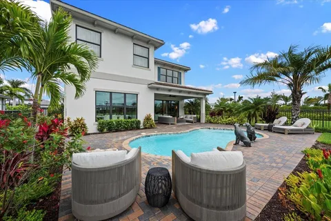 a view of a chairs and table in a backyard