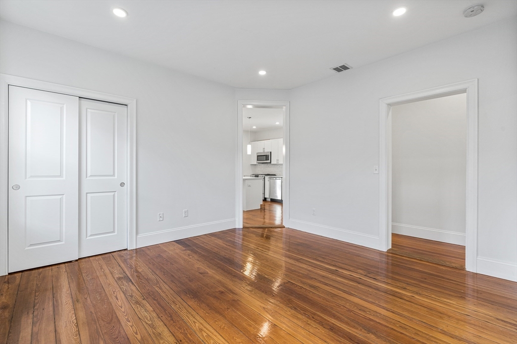 307 Hancock Street, Unit 3 Boston, MA 02125 - Photo 17 of 25 a view of empty room with wooden floor