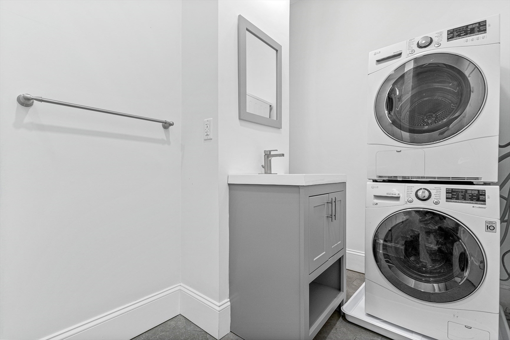 307 Hancock Street, Unit 3 Boston, MA 02125 - Photo 22 of 25 a utility room with dryer and washer