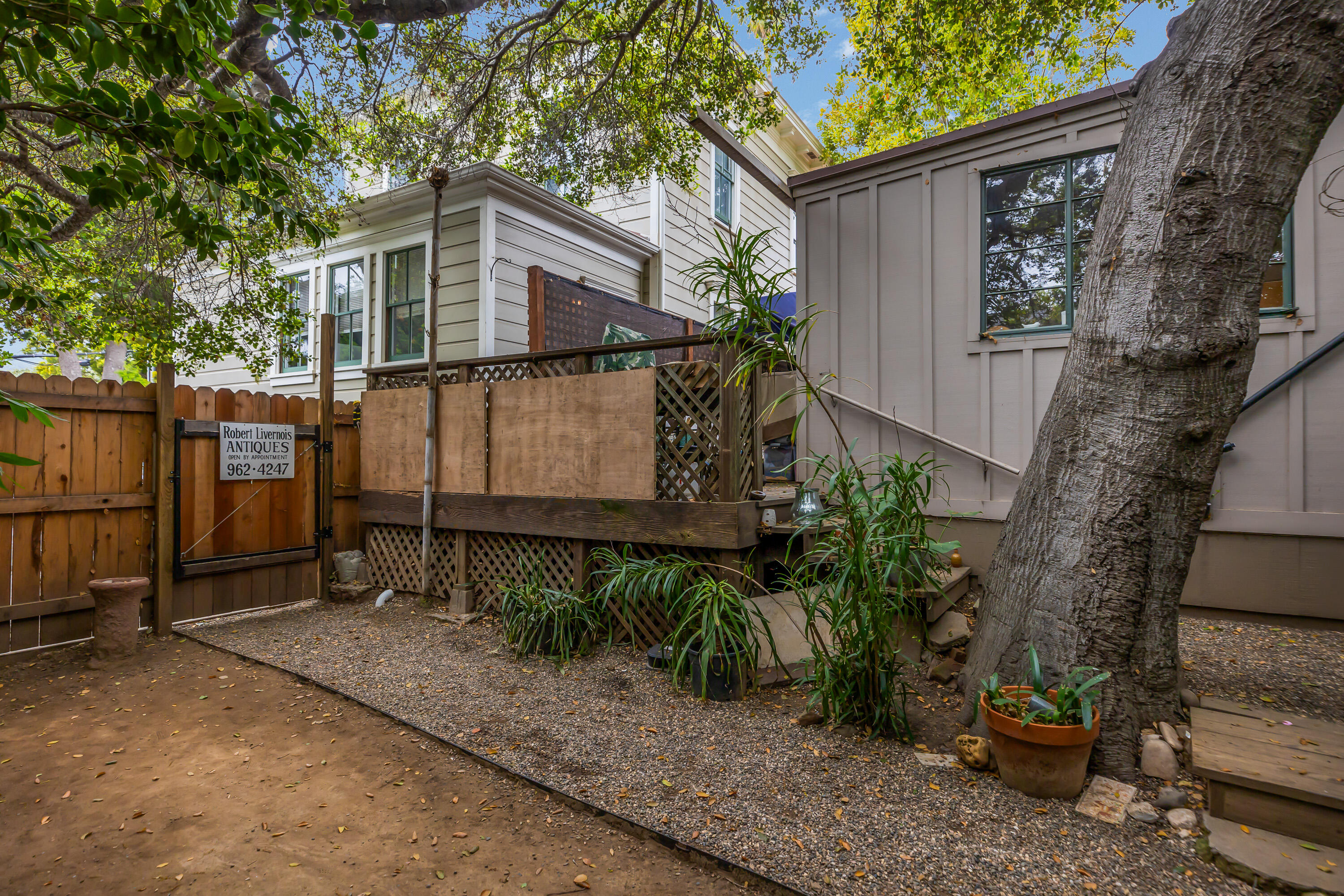 533 Brinkerhoff Avenue Santa Barbara, CA 93101 - Photo 11 of 27 a backyard of a house with potted plants and large tree