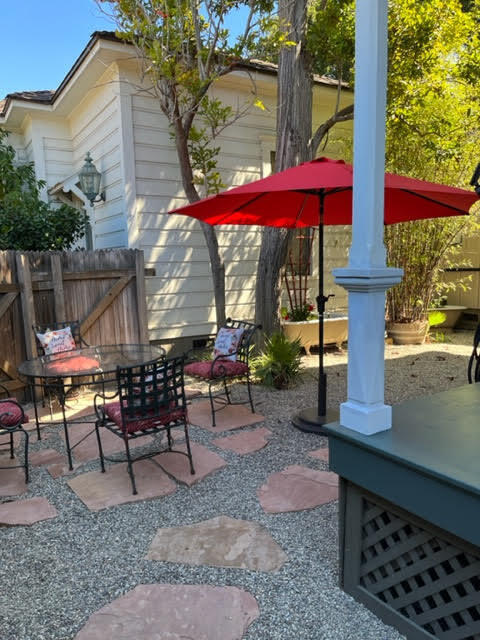 533 Brinkerhoff Avenue Santa Barbara, CA 93101 - Photo 13 of 27 a view of a patio with table and chairs under an umbrella