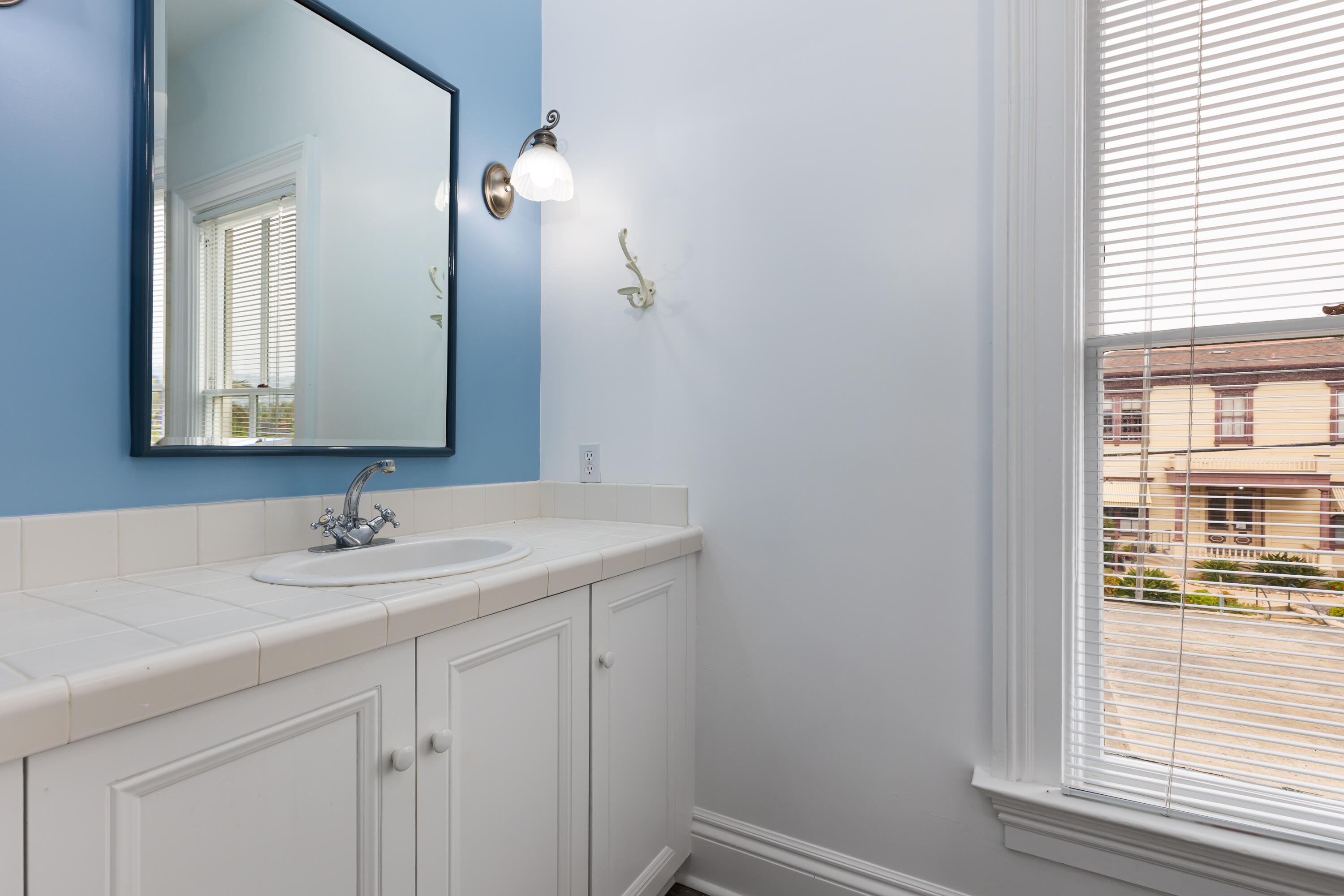533 Brinkerhoff Avenue Santa Barbara, CA 93101 - Photo 24 of 27 a bathroom with a sink and a mirror