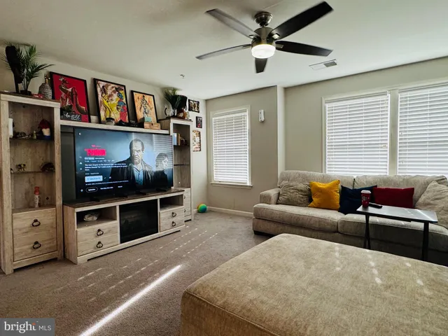 a bedroom with a bed and a large mirror